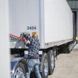 Truck Driver Hooking Up Truck