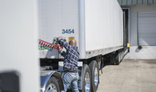 Truck Driver Hooking Up Truck