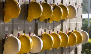 Yellow safety hardhats hanging on locker doors