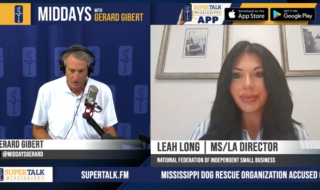 Two hosts in a split-screen interview: man in a studio with a microphone on the left and a woman on video chat on the right, with 'MIDDAYS with GERARD GIBERT' branding above.